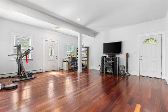 entrance foyer featuring wood finished floors, recessed lighting, and a baseboard radiator