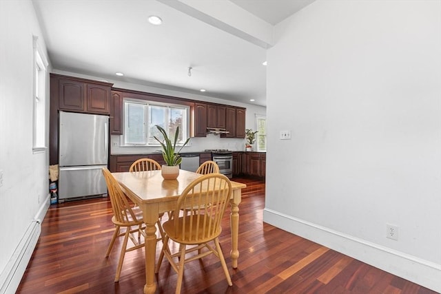dining area with a baseboard heating unit, plenty of natural light, recessed lighting, and dark wood-style flooring