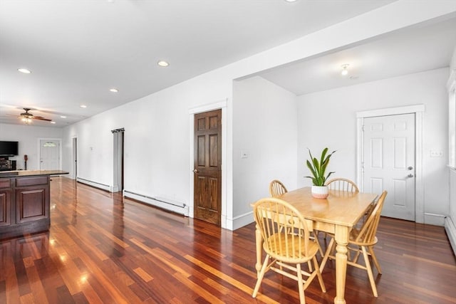 dining area with a baseboard heating unit, a ceiling fan, dark wood-style floors, recessed lighting, and baseboards