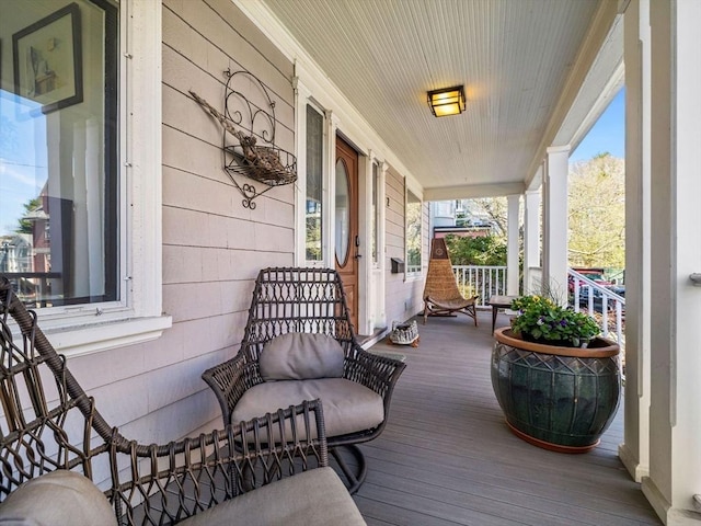 wooden terrace with a porch