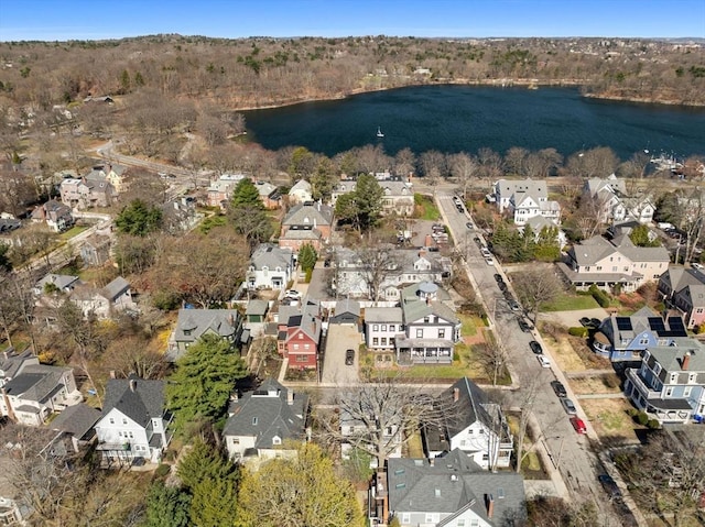 drone / aerial view featuring a water view and a residential view