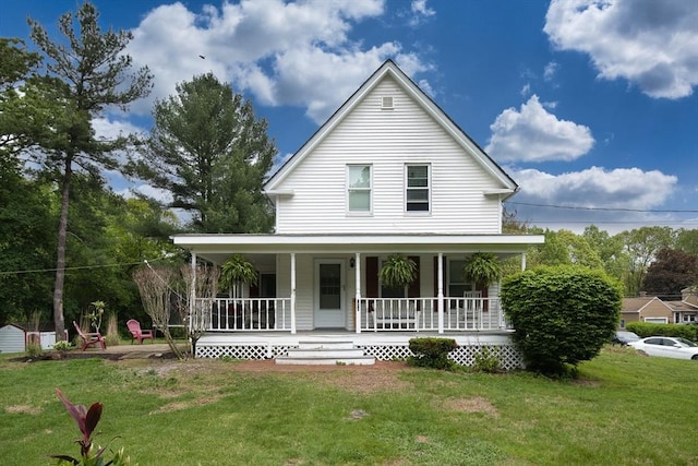 735 Hildreth St, Dracut, MA 01826 - country-style home with covered porch and a front lawn