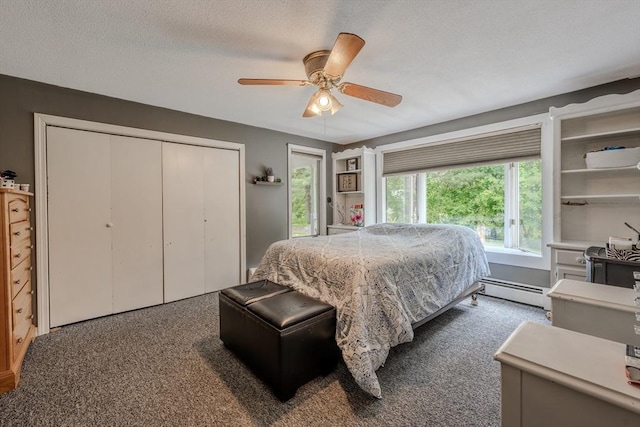 735 Hildreth St, Dracut, MA 01826 - bedroom with a baseboard radiator, a closet, ceiling fan, and dark colored carpet
