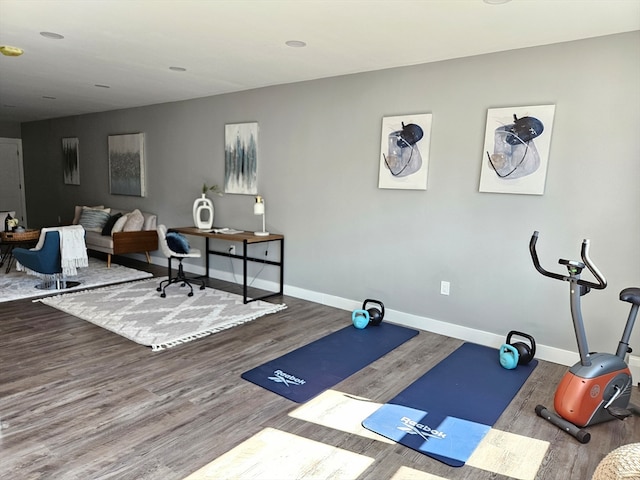 workout area featuring hardwood / wood-style floors