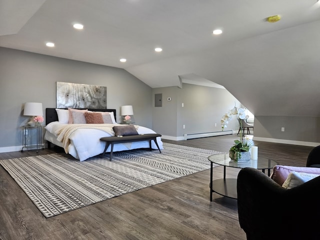 bedroom featuring vaulted ceiling, dark hardwood / wood-style floors, and a baseboard heating unit