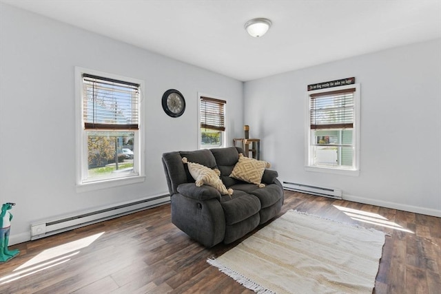 living area with plenty of natural light, a baseboard radiator, and dark wood-style floors