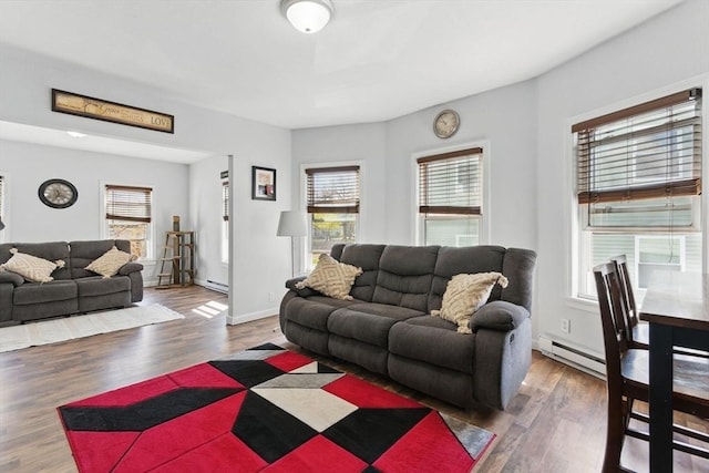 living area with a healthy amount of sunlight and wood finished floors
