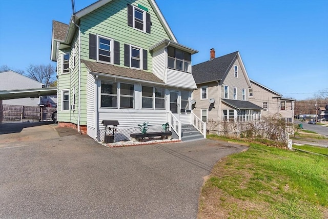 view of front of house with a shingled roof