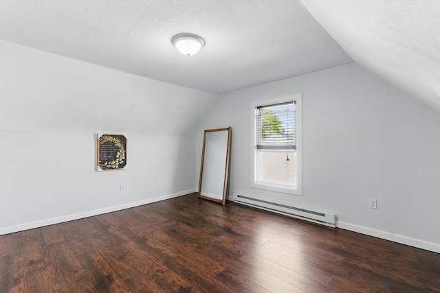 bonus room with a textured ceiling, vaulted ceiling, wood finished floors, and a baseboard radiator