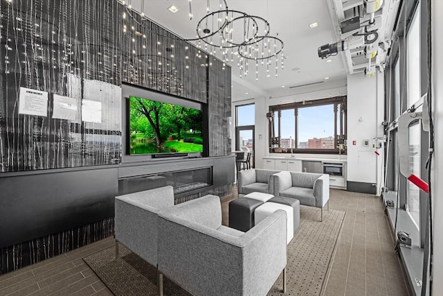 living area featuring a chandelier and recessed lighting