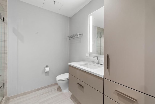 full bathroom featuring a shower stall, toilet, and vanity