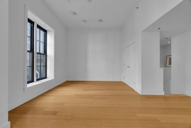 spare room with light hardwood / wood-style flooring