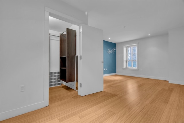 spare room featuring light wood-type flooring