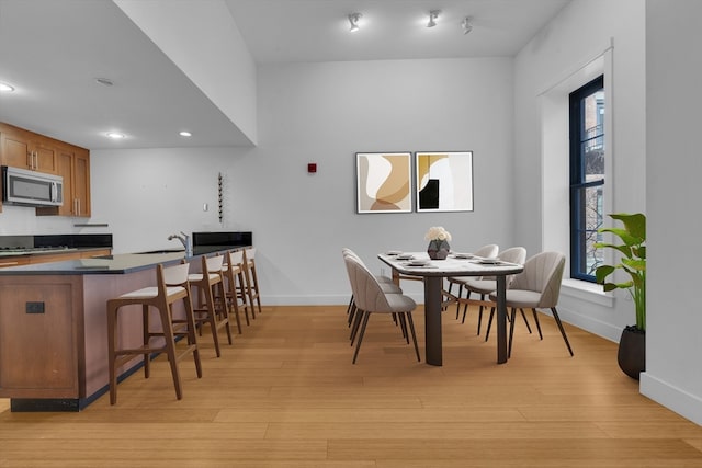 dining space featuring light hardwood / wood-style flooring