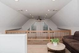 interior space featuring lofted ceiling and recessed lighting