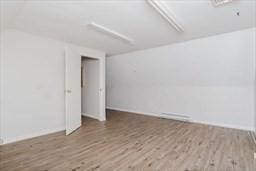 unfurnished room featuring wood finished floors