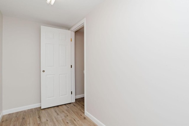 interior space with light wood-style flooring and baseboards