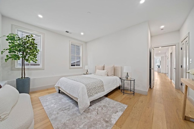59 Falcon St Unit 1, Boston, MA 02128 - bedroom with multiple windows, light wood-style flooring, and recessed lighting