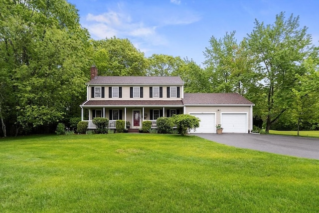 181 Dexter Farms Rd, Taunton, MA 02780 - colonial inspired home with an attached garage, a porch, a chimney, a front lawn, and driveway