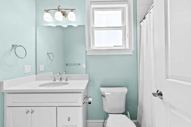 bathroom with vanity, toilet, and a shower with curtain