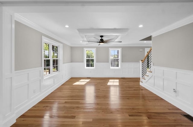 spare room featuring crown molding, ceiling fan, and wood-type flooring