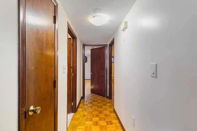 corridor with light parquet floors