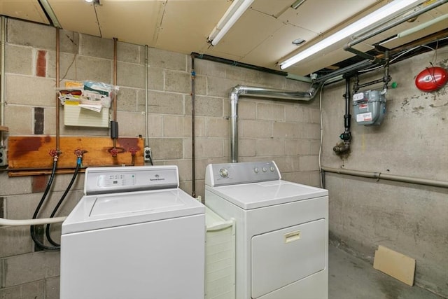 laundry room featuring separate washer and dryer