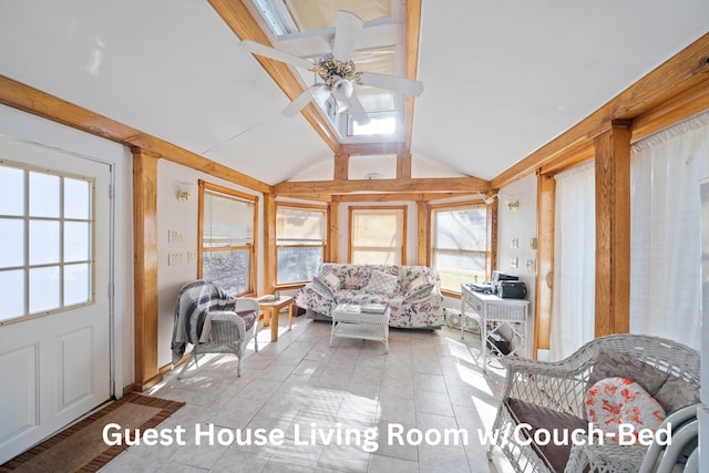 sunroom / solarium featuring a wealth of natural light, lofted ceiling, and ceiling fan