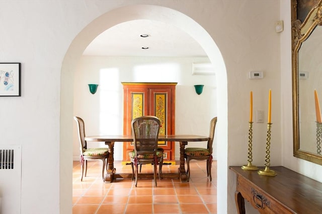 5 Southwick, Newton, MA 02468 - dining space featuring arched walkways, light tile patterned floors, and radiator