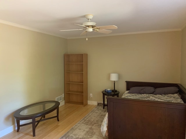 bedroom with ornamental molding, light hardwood / wood-style flooring, and ceiling fan