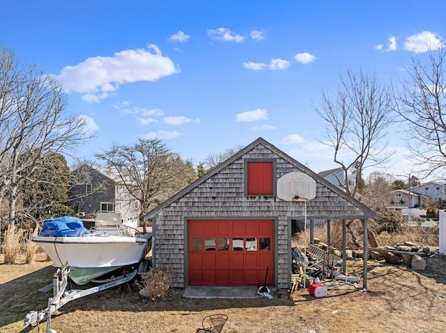 view of outbuilding featuring driveway and an outdoor structure