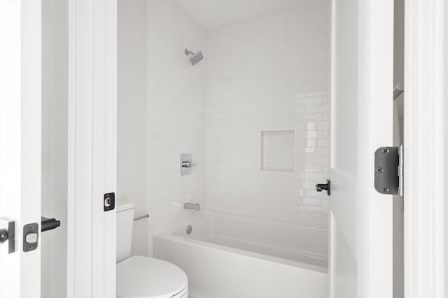 bathroom featuring toilet and shower / washtub combination