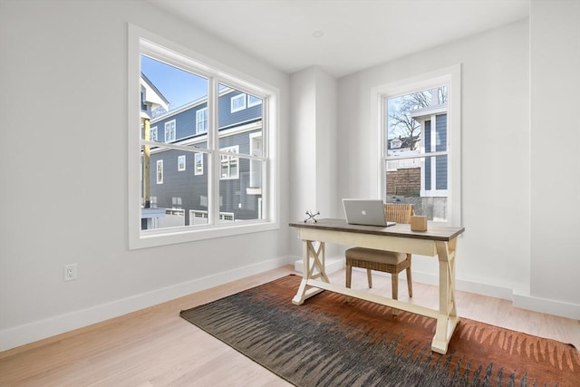 office with wood finished floors and baseboards