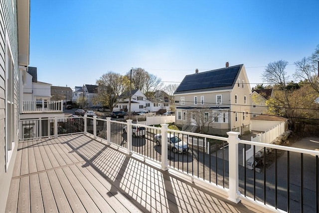 wooden deck featuring a residential view