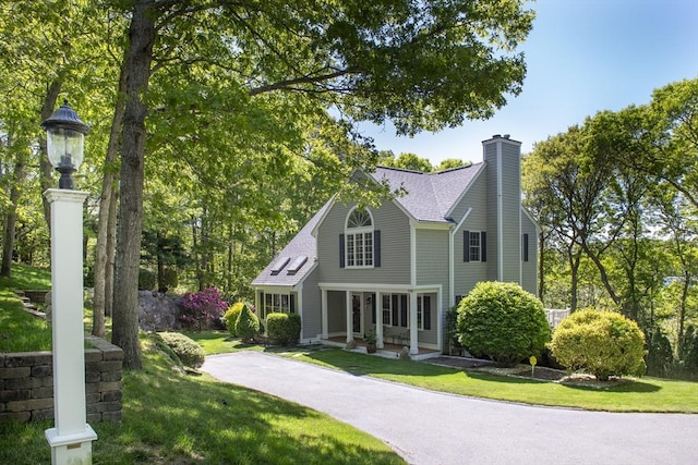 2181 Service Rd, Barnstable, MA 02668 - back of property with a chimney, a yard, and a shingled roof