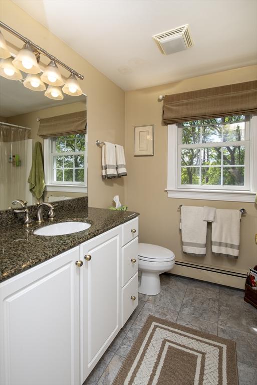 2181 Service Rd, Barnstable, MA 02668 - bathroom with a baseboard radiator, vanity, toilet, and a shower with curtain
