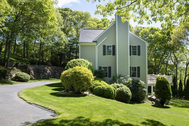 2181 Service Rd, Barnstable, MA 02668 - view of home's exterior featuring a chimney and a yard