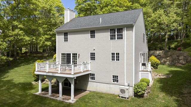2181 Service Rd, Barnstable, MA 02668 - rear view of property with ac unit, a chimney, a yard, and a wooden deck