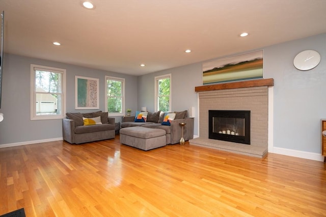 3 Eileen Rd, Norton, MA 02766 - living room featuring wood finished floors, healthy amount of natural light, recessed lighting, a brick fireplace, and baseboards