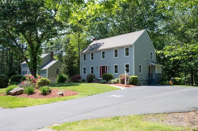 3 Eileen Rd, Norton, MA 02766 - colonial inspired home with a front lawn and view of scattered trees