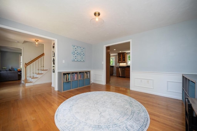 3 Eileen Rd, Norton, MA 02766 - living area featuring stairs, light wood-style flooring, and wainscoting