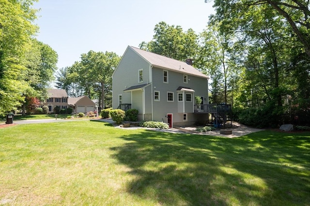 3 Eileen Rd, Norton, MA 02766 - back of property featuring a wooden deck, stairway, a lawn, and a chimney