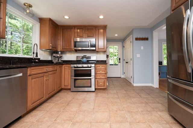 3 Eileen Rd, Norton, MA 02766 - kitchen with appliances with stainless steel finishes, recessed lighting, light tile patterned floors, brown cabinetry, and baseboards