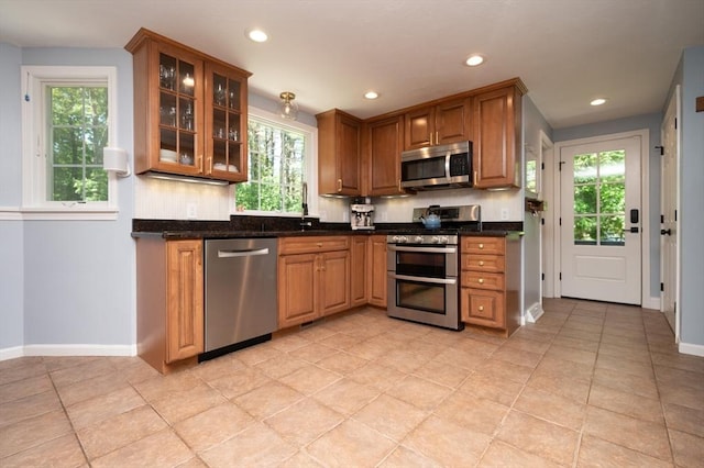 3 Eileen Rd, Norton, MA 02766 - kitchen with stainless steel appliances, baseboards, glass insert cabinets, recessed lighting, and a sink