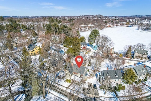 snowy aerial view featuring a residential view