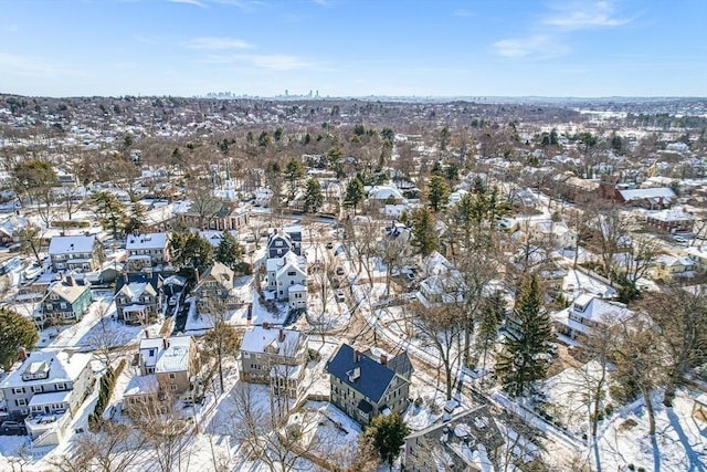 snowy aerial view with a residential view