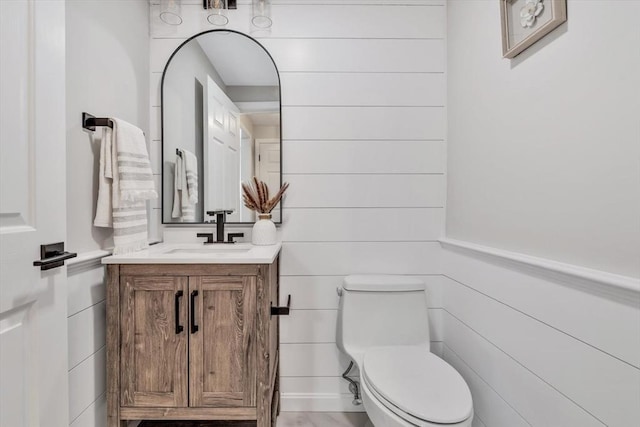 bathroom with vanity and toilet