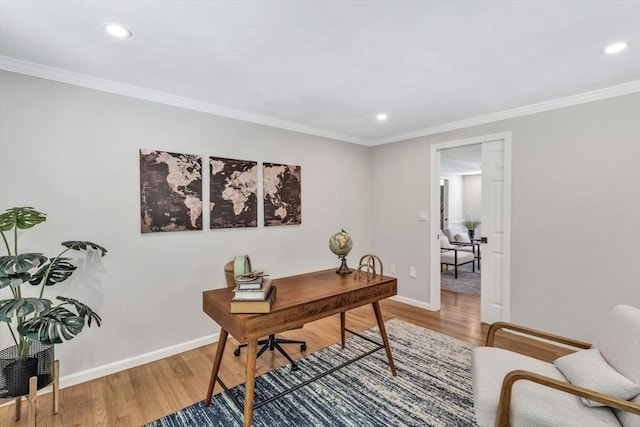 home office featuring hardwood / wood-style flooring and crown molding