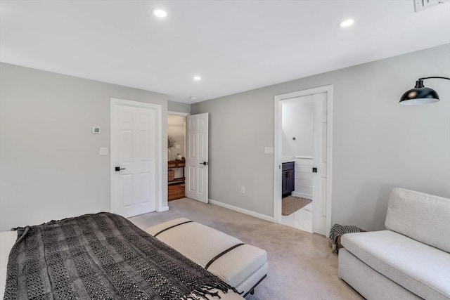 carpeted bedroom with ensuite bath