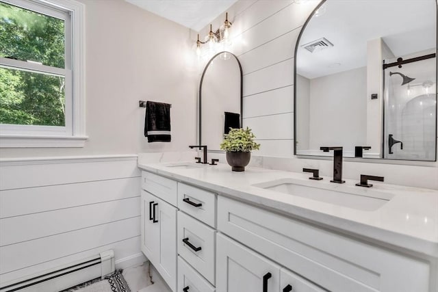 bathroom featuring vanity, an enclosed shower, and a baseboard radiator